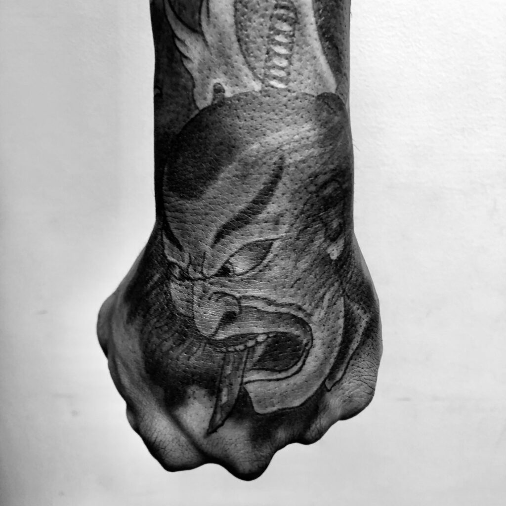 Japanese Namakubi severed head hand tattoo, black and grey – Primitive Tattoo Perth